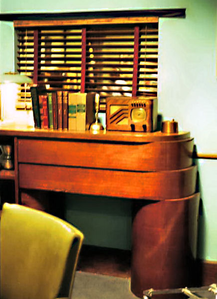 Art deco table with radio and books